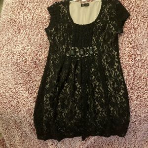 Scoopneck lace overlay dress. Crystal detail on waist.